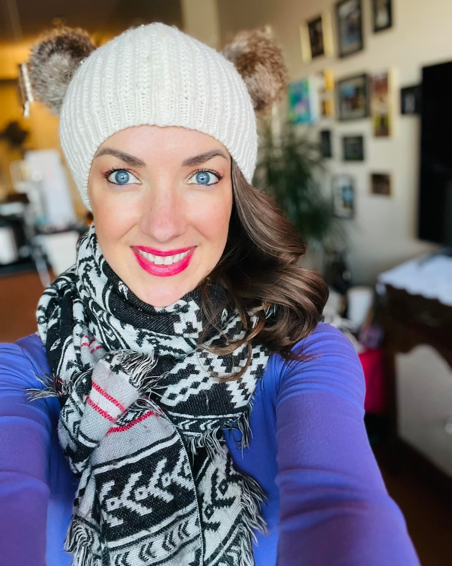 Lara Brightside smiling during a winter adventure.